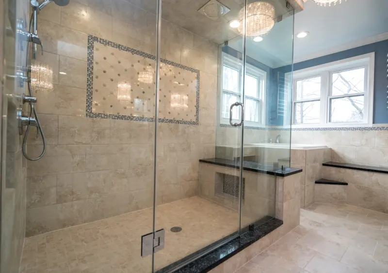 Tiled walk-in shower with glass enclosure