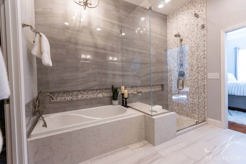 Bathroom with soaking tub and tiled shower