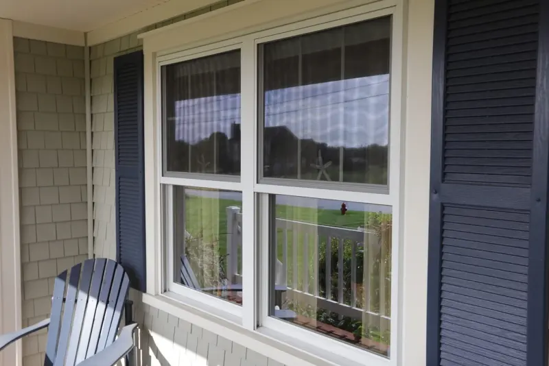 Double-hung windows with shutters